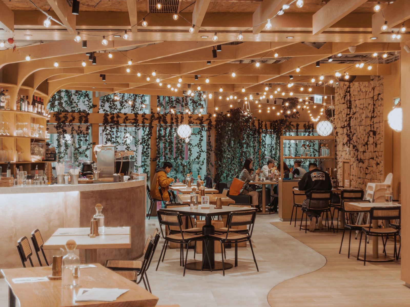 The candlelit Arts District dining room at Bestia, wood-oven glowing at the pass